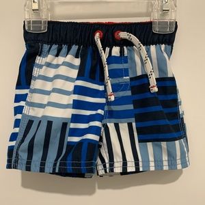 Gap baby boy blue white and black swim shorts. Size 0-6 months.